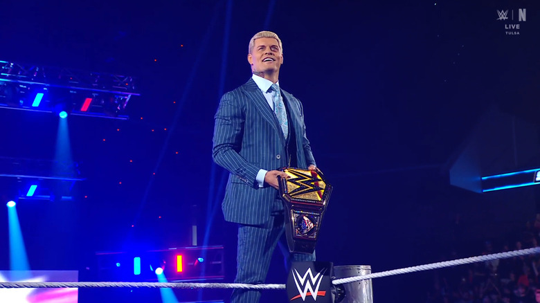 Rhodes posing on the turnbuckles