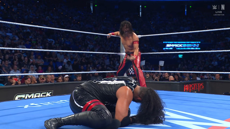 Nakamura standing over Talla in the ring