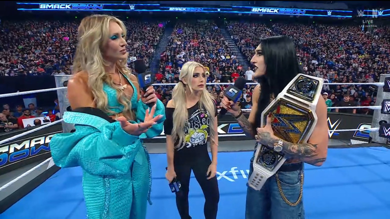 Flair, Bliss, and Ripley in the ring
