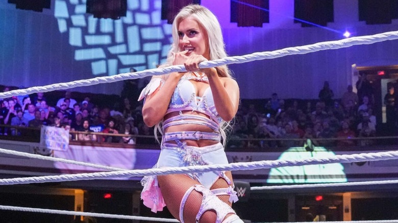 Blake Monroe poses on the ropes and looks to the crowd before a match on 