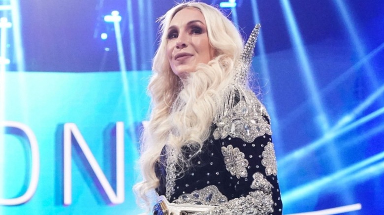 Charlotte Flair is amused in her ring robe