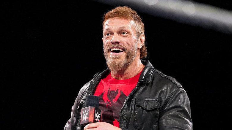Edge smiling in a WWE ring
