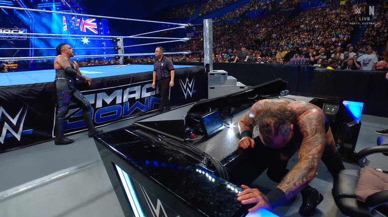 Priest and Black near the announce desk
