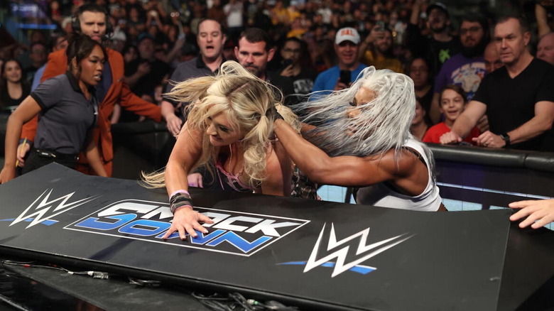 Jade Cargill throws Tiffany Stratton over the announce table