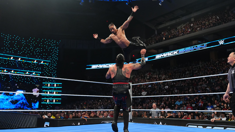 Carmelo Hayes diving on Damien Priest