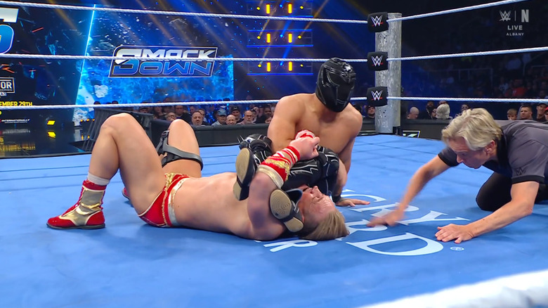 Axiom with an armbar cinched in on Dragunov