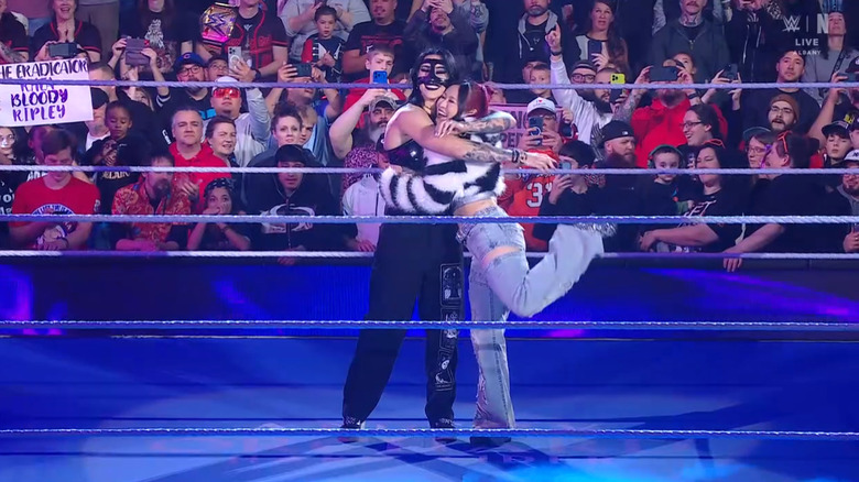 Ripley and SKY hugging one another