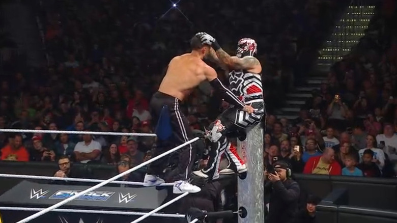 Balor and Penta teetering on the ropes