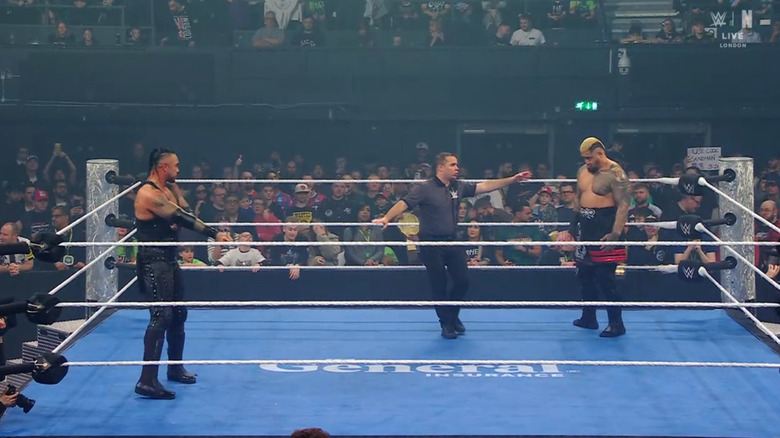 Priest and Sikoa staring one another down