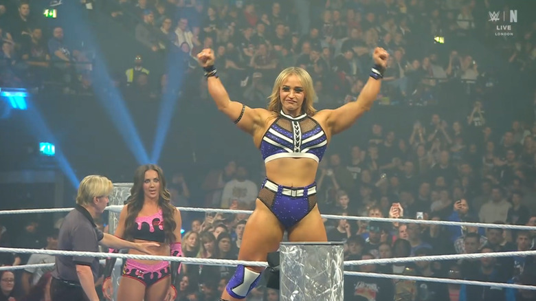 Grace posing on the ropes with Green in the background