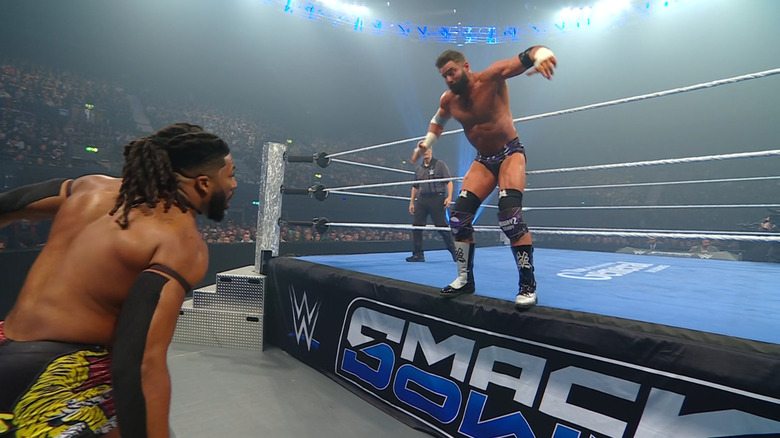 Williams and Cardona on the outside of the ring