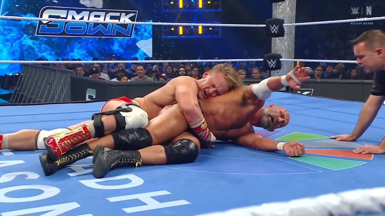 Dragunov with a Waist Lock cinched in on Ciampa