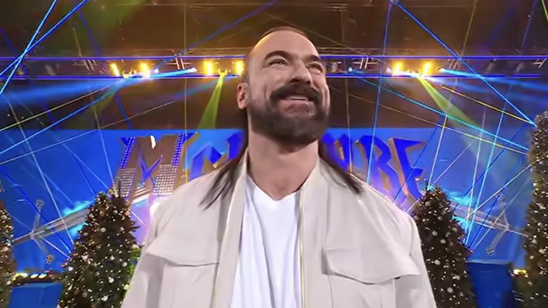Drew McIntyre smiles widely as he makes his entrance.