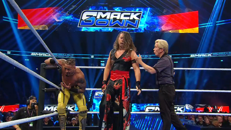 Hayes and Nakamura in the ring