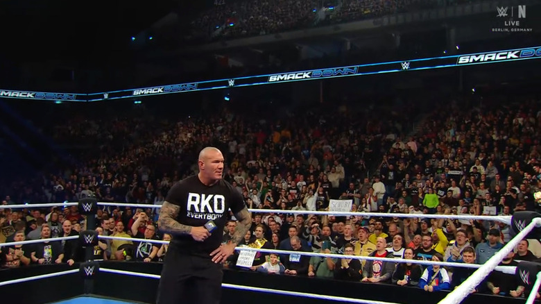 Orton in the ring surrounded by the fans