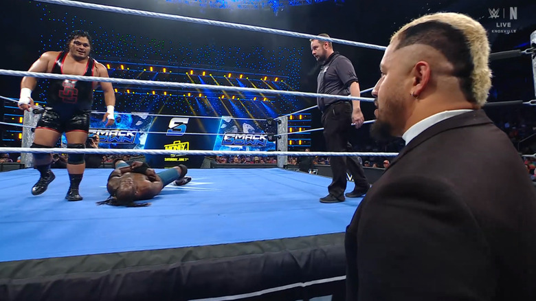 Mateo and Truth in the ring as Sikoa watches from the outside