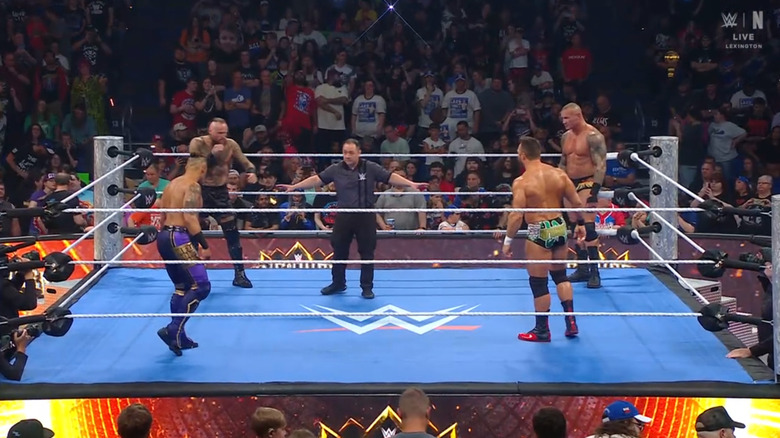 The four men in the ring staring each other down