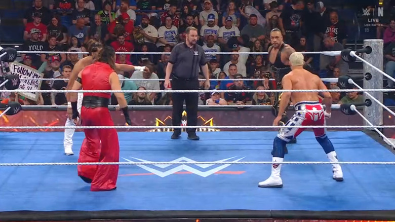 The four men in the ring staring each other down