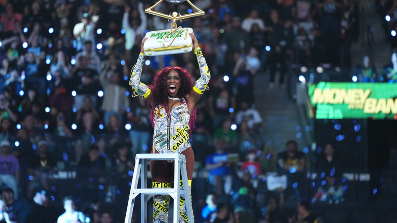 Naomi grabbing the Women's Money In The Bank briefcase