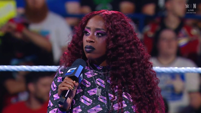 Naomi in the ring about to speak