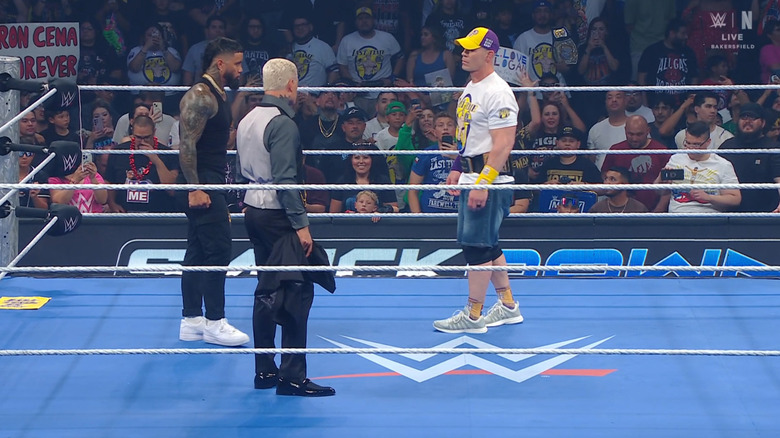 Jey, Rhodes, and Cena in the ring