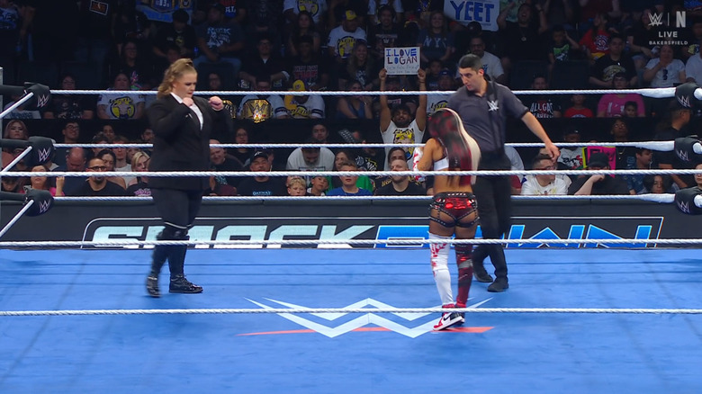 Niven and Vega staring each other down in the ring