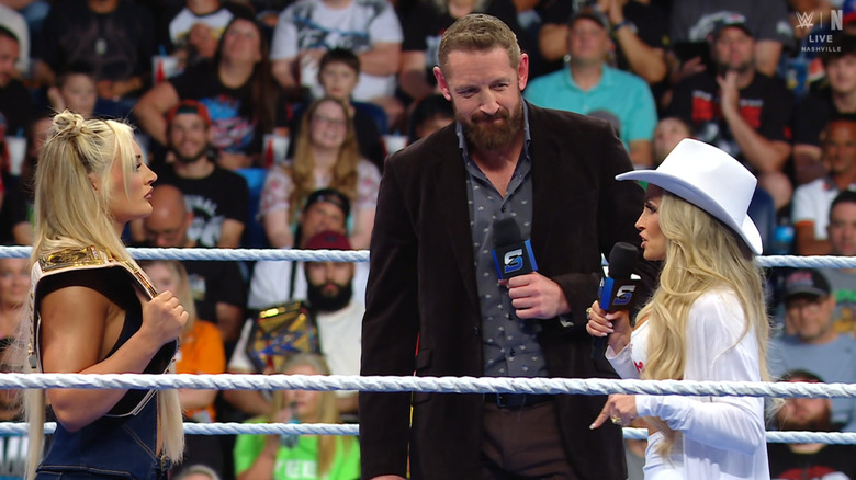 Stratton and Stratus speaking to one another in the ring