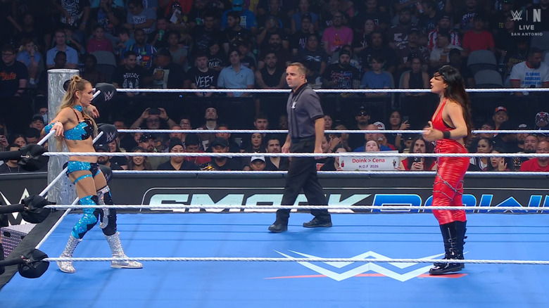 Flair and Rodriguez staring one another down