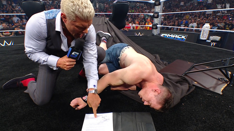 Rhodes forcing Cena to sign the contract