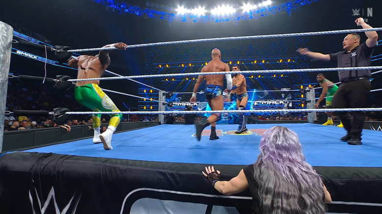 Everyone in the ring as LeRae watches from the outside