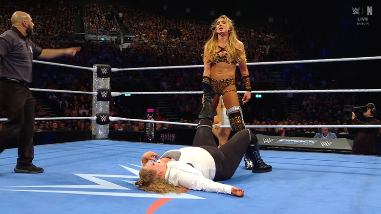 Flair about to cinch in the Figure Eight Leg Lock on Niven