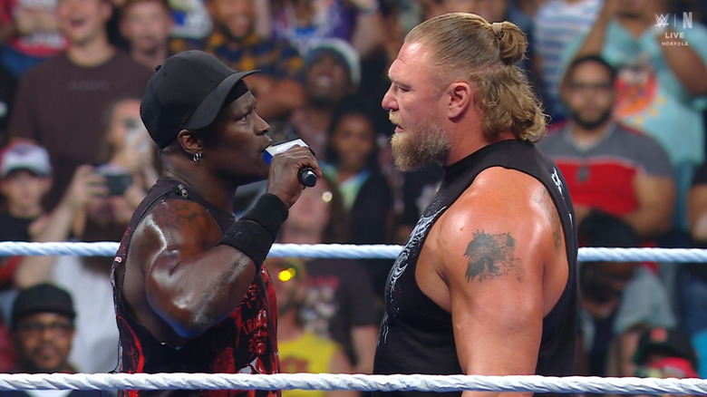 Killings and Lesnar staring one another down in the ring