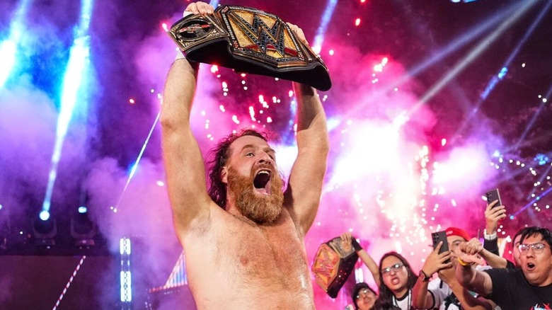 Sami Zayn holds up the Undisputed WWE Championship as pyro goes off behind him following his victory over CM Punk on the September 11, 2026 edition of 