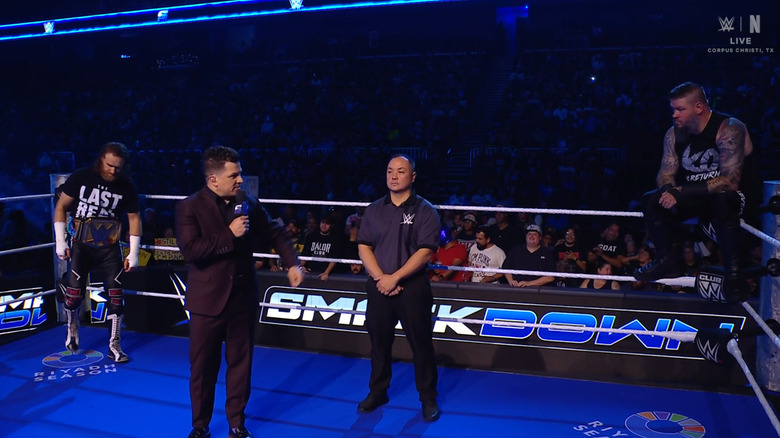 Zayn and Owens in the ring during the ring announcement
