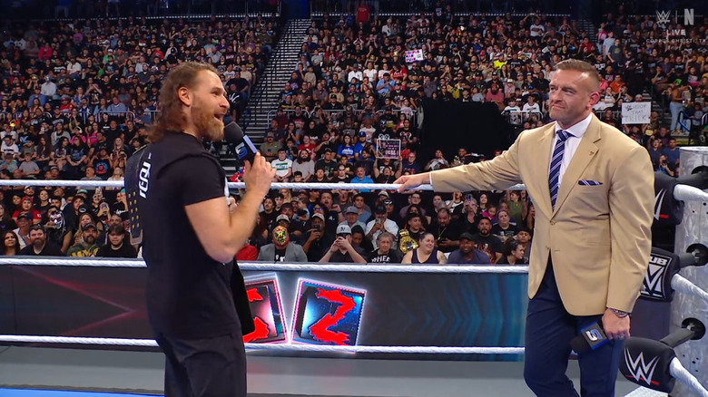 Zayn and Aldis in the ring with one another