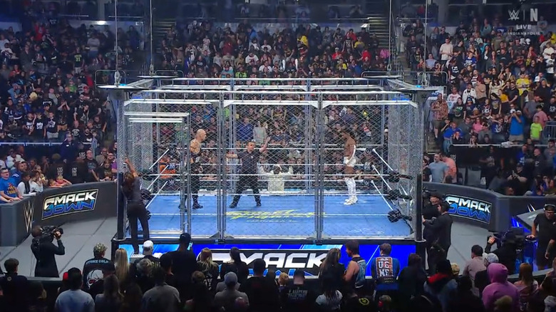 Corbin and Williams staring down one another inside the cage