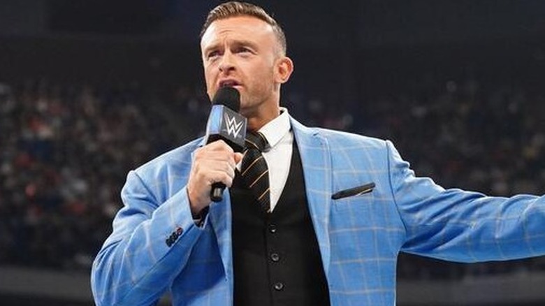 On-screen "WWE SmackDown" General Manager Nick Aldis makes an important announcement in the ring