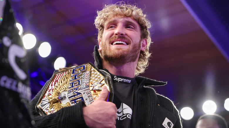 Logan Paul poses with WWE United States Championship