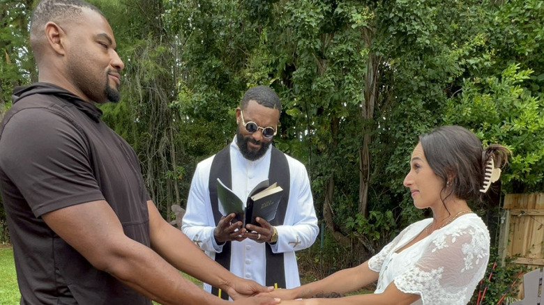 Montez Ford is seen officiating the wedding of his tag team partner and friend Angelo Dawkins and his wife, Grace Russo, in a backyard ceremony.