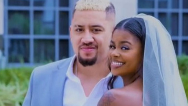 Solo Sikoa poses with wife Almia Williams at their wedding in a series of photos posted to his Instagram account.