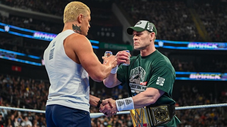 Cody Rhodes and John Cena toast with beers in the middle of the ring following Cena's babyface turn on 
