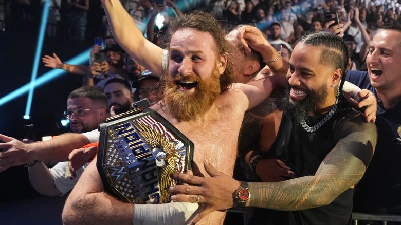 Sami Zayn celebrates with Jimmy Uso