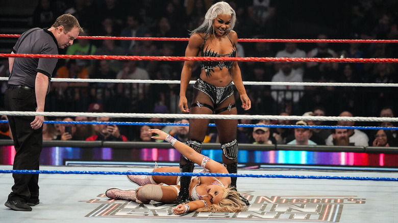 Jade Cargill stands over Tiffany Stratton