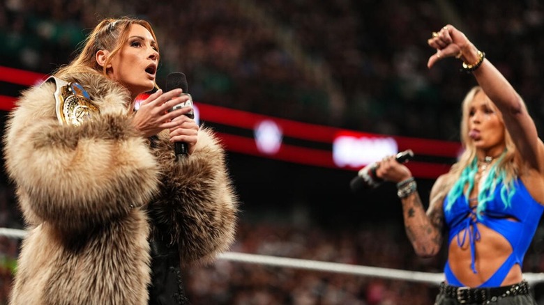 Becky Lynch cuts a promo on Sol Ruca, who sticks her tongue out in a thumbs-down gesture, in the ring during an episode of "WWE Raw."