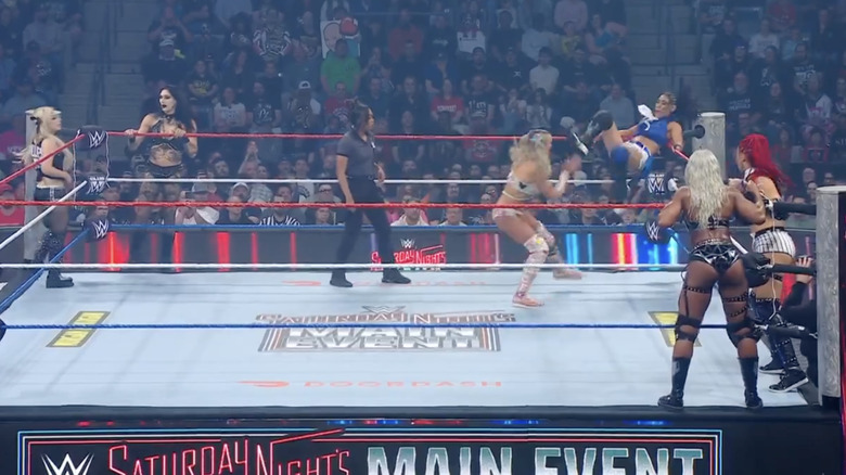 All six women in and around the ring