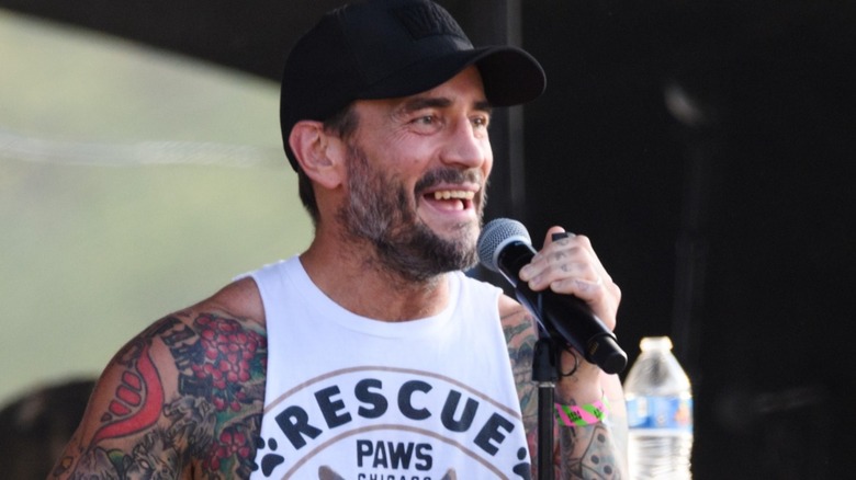CM Punk on stage at a concert