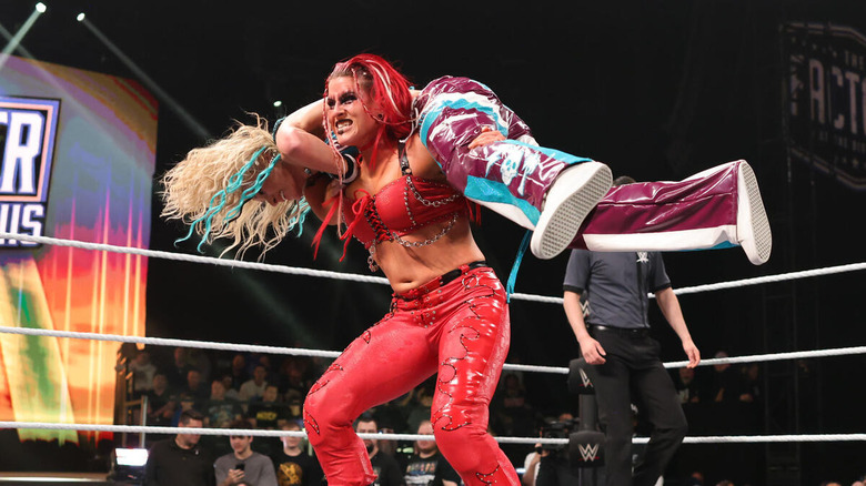 Zaria with Sol Ruca on her shoulders at Stand & Deliver