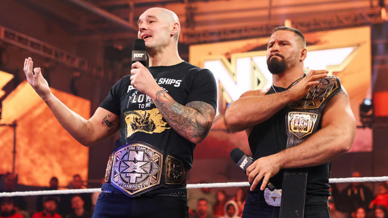 Baron Corbin and Bron Breakker with their NXT titles
