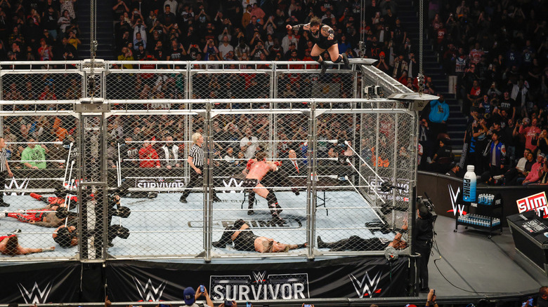 Bronson Reed delivers a Tsunami from the top of a cage