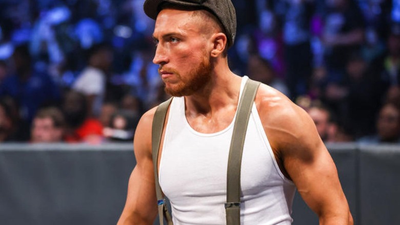 Butch looks on at a Brawling Brutes match going on in the ring during "WWE SmackDown."